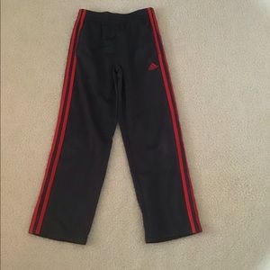 Red and grey adidas pants